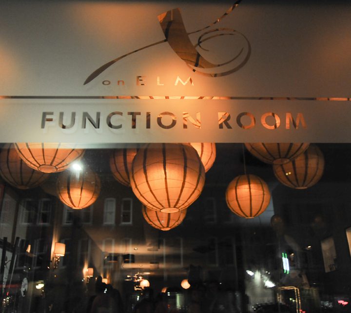 This picture is an image of the function room sign on a window at XO Bistro in Manchester, NH.
